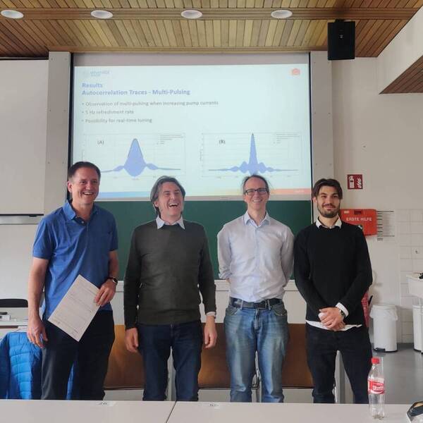 Felix Harfmann after a successfull defense next to the professors who held the exam.