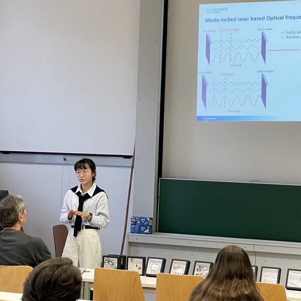Huizi Li holding her presentation in front of the faculty.