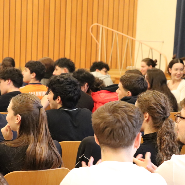 Picture of the audience full of students.