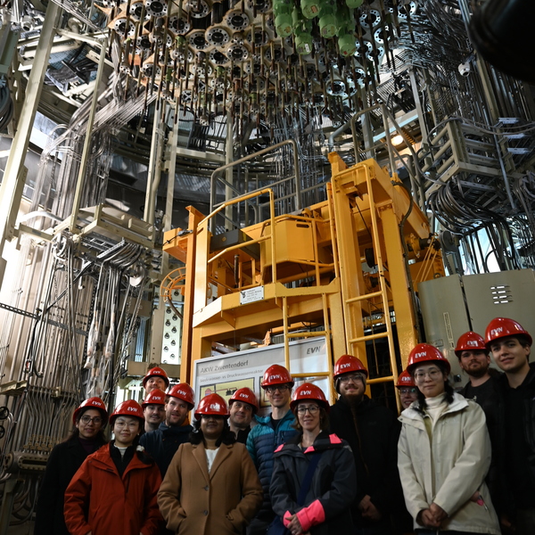 The optical metrology group inside the nuclear power plant in front of the fuel rods.